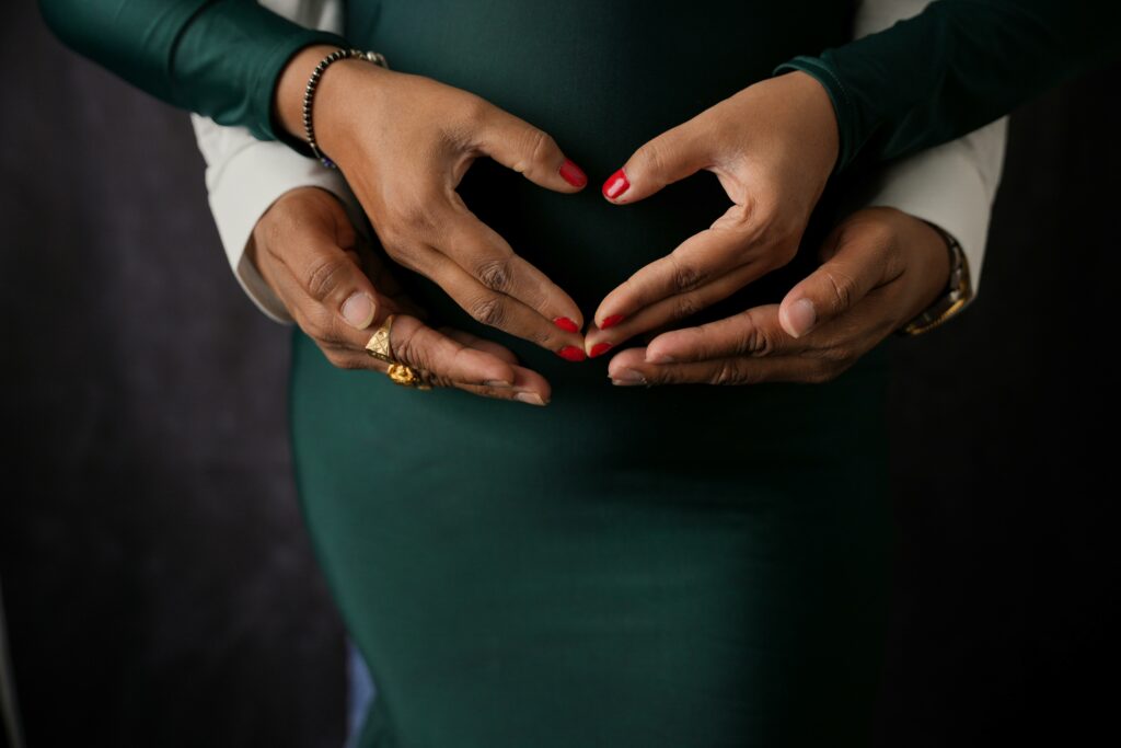 black maternal health : hands on a pregnant belly